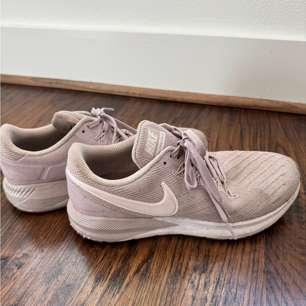 Mauve Nike running shoes